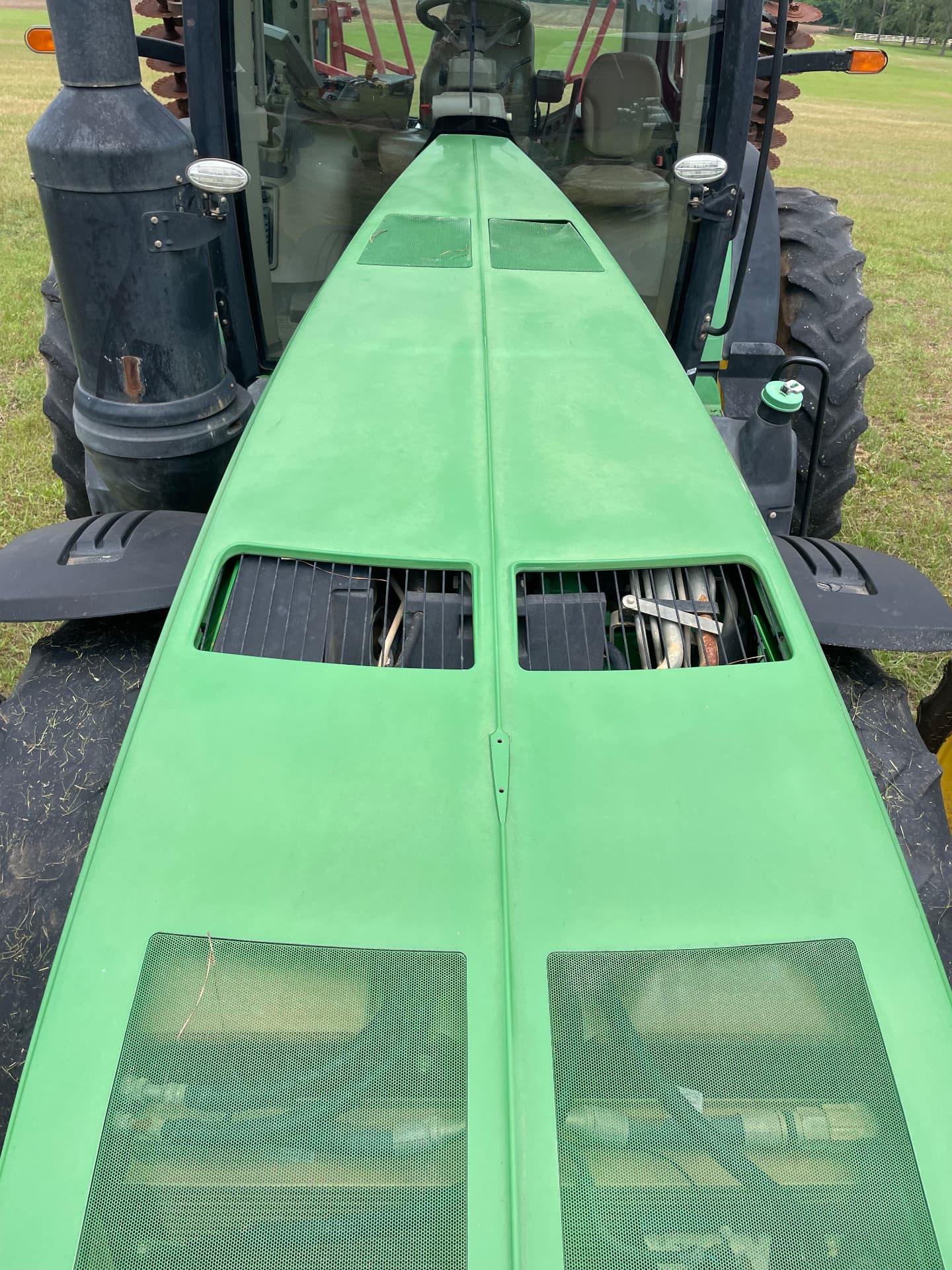 Faded, dull John Deere tractor hood before detailing