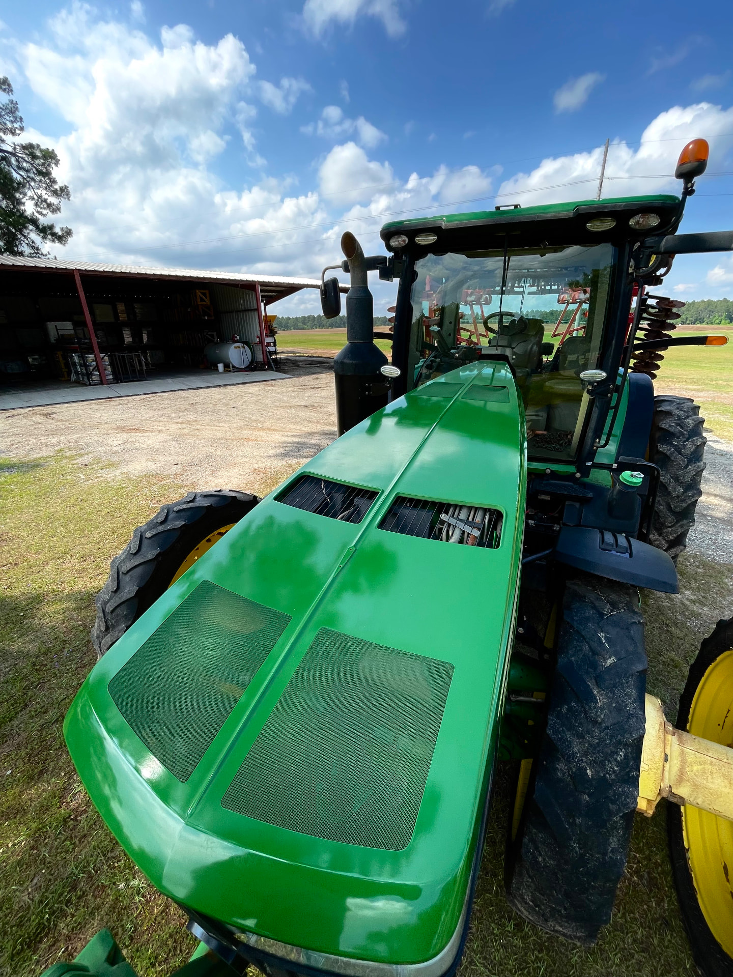Same John Deere tractor hood restored to a deep glossy shine